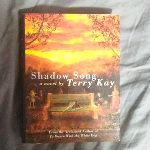 A book titled "shadow song" by author terry Kay.